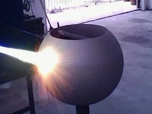 Thermal spraying of tungsten carbide and Alloy 6 hardfacing onto a trunnion valve ball