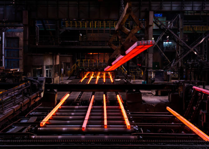 Forged silhouettes against a fiery horizon—the iron and steel industry shapes a landscape of progress.